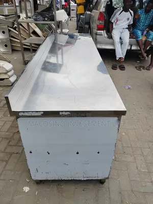 Stainless Steel Commercial Kitchen Work Table Featuring Slide Doors