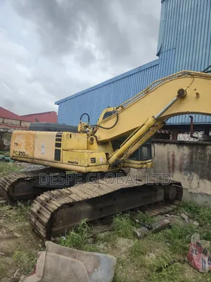 A Foreign Used Faulty Komatsu Pc210 Excavator