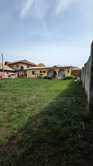 A Standard Plot Of Land At Progressive Estate On A Tarred Road