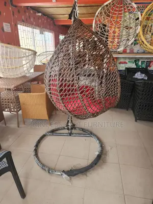 Brown Relaxation Swing Chair With Brown Cushion