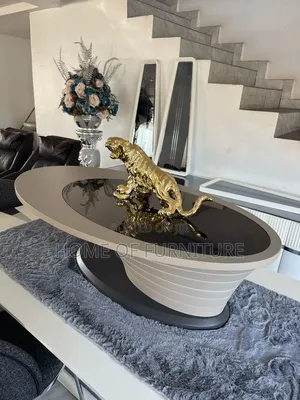 Oval Glass Center Table – Modern Wave Design 