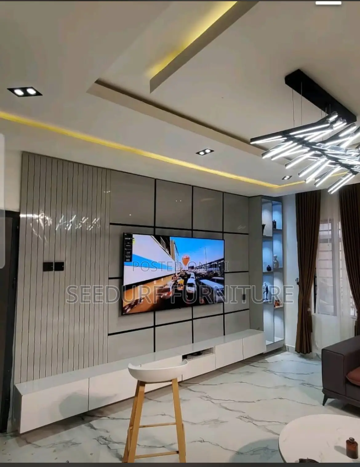 A Wall to Wall Glossy Made Tv Console