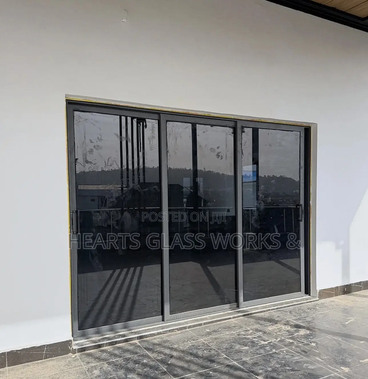 Aluminium Ghana Sliding With Dark Grey Glass