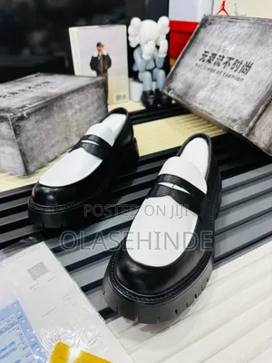 White and Black Male Loafer
