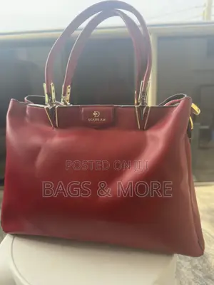 Elegant Red Bag With Gold Hardware