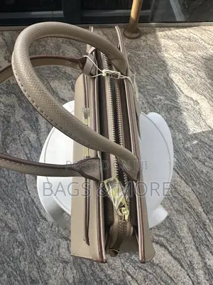 A Brown Bag With Gold Clasp