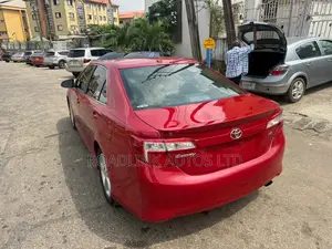 Toyota Camry SE 4dr Sedan w/Prod. End 11/13 (2.5L 4cyl 6A) 2014 Red