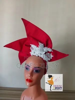 A Pink Asoke Fascinator With White Trims