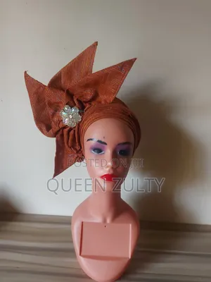 A Pink Asoke Fascinator With White Trims