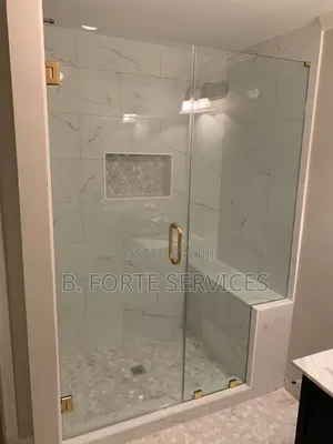 Glass Shower Cubicle With Gold Accessories