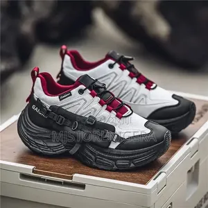 Brand Men's Fashion Sneakers in White and Black With Red Accents.