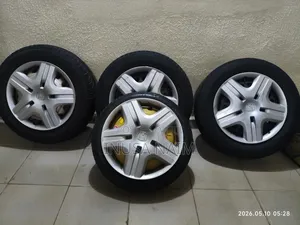 14 Inch Iron Rims, Tyres and Wheel Cover.