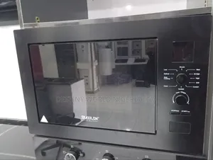 Built-in Microwave Oven With a Glass Door and Rotary Control Knob