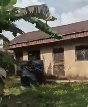 Distressed Sale: 50×100 Land With Fish Ponds Building