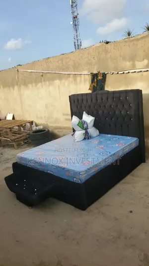 Executive 6 X 6 Upholstery Bedframe With an Ottoman