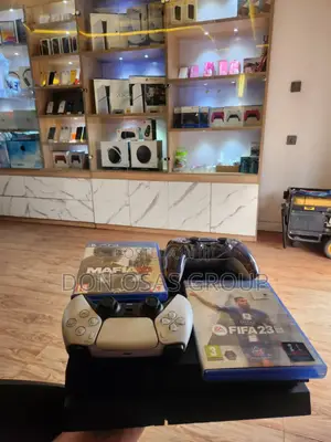 Unhacked Ps4 Fat With 2 Working Pads, 2 Cds(Fifa 23 and Mafia 3)