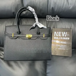 Hand Held Kelly Bag