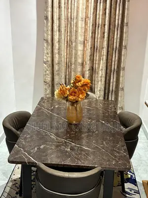 Alibert Marble Dining Table With Contemporary Leather Chair