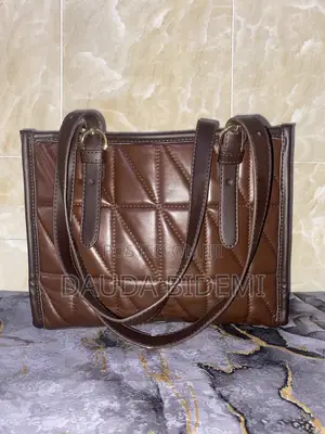 A Brown And Leather Bag