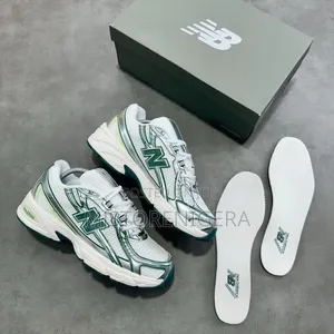 New Balance 740 Sneakers in the Marsh Green and Sea Salt Colorway.