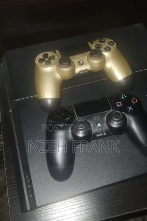 Neatly Used Ps4 Fat, With 2 Controller Pads and 6 Game CDS