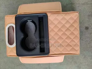 Car Armrest Organizer With a Quilted Design.