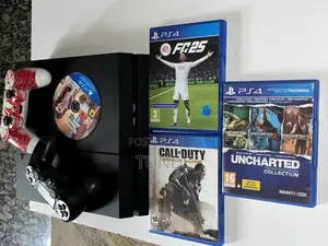 Neatly Used Ps4 Console With 2pads and 4disc Games.