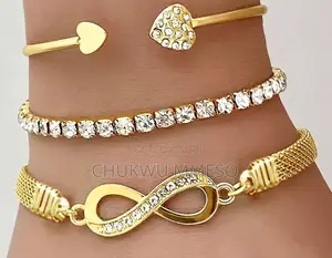 A Set of Three Women's Bracelets and Bangles Adorned With Rhinestones