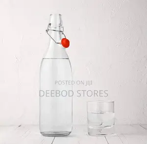 Cello Aquaria Glass Water Bottle With a Swing-Top Lid.