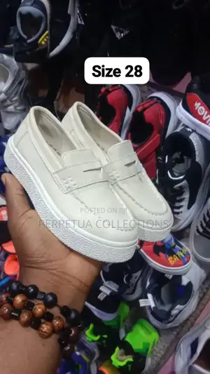 We Sells All Kinds of Children and Adults Shoes, Both Children Clothes