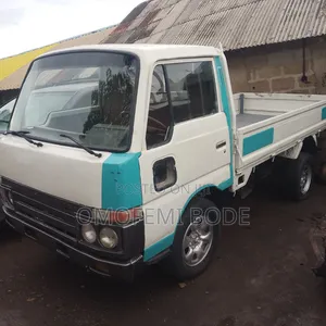 Nissan Cabstar With Normal Bucket Petrol Engine 1999 White
