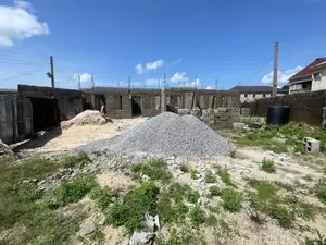 1 Plot of Land With Four Uncompleted Mini Flats on It.