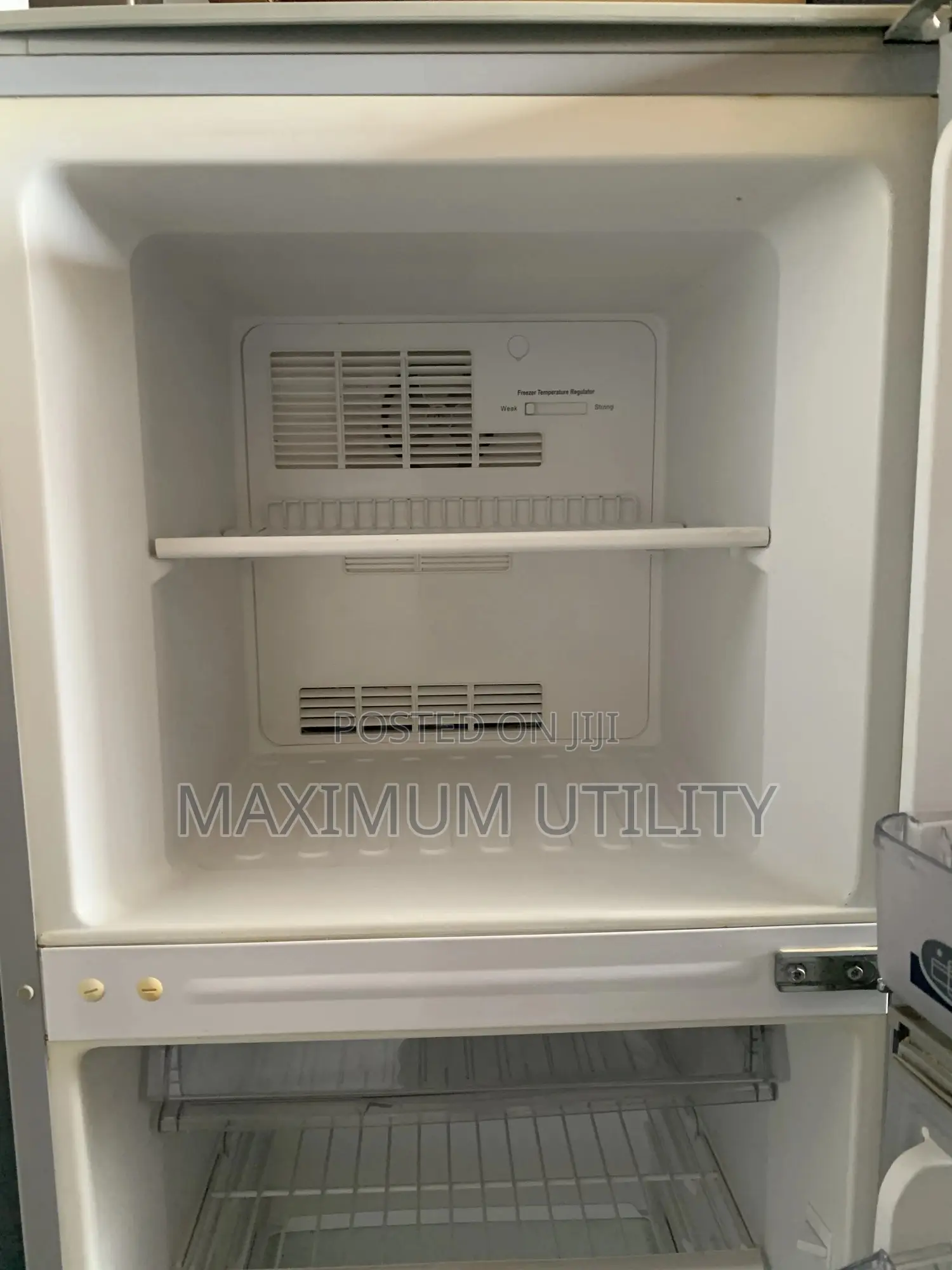 Frigidaire Cool Master Silver Top-Freezer Refrigerator.