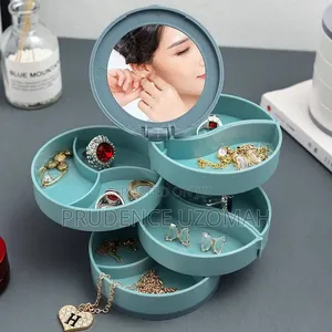Elegant 4-Layer Rotating Jewelry Makeup Organizer With Mirror