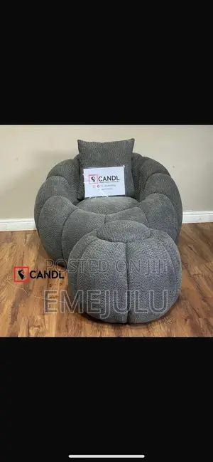 Luxurious Single Sofa Seater Alongside a Stool