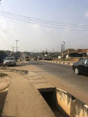 2 Plots of Land With a 3 Bedroom Flat 2 Shops Facing the Major Road