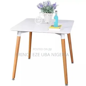 Table With Wooden Legs and Iron Leg