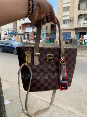 A Mini Tote Bag and Portable Handbag With Longer Strips