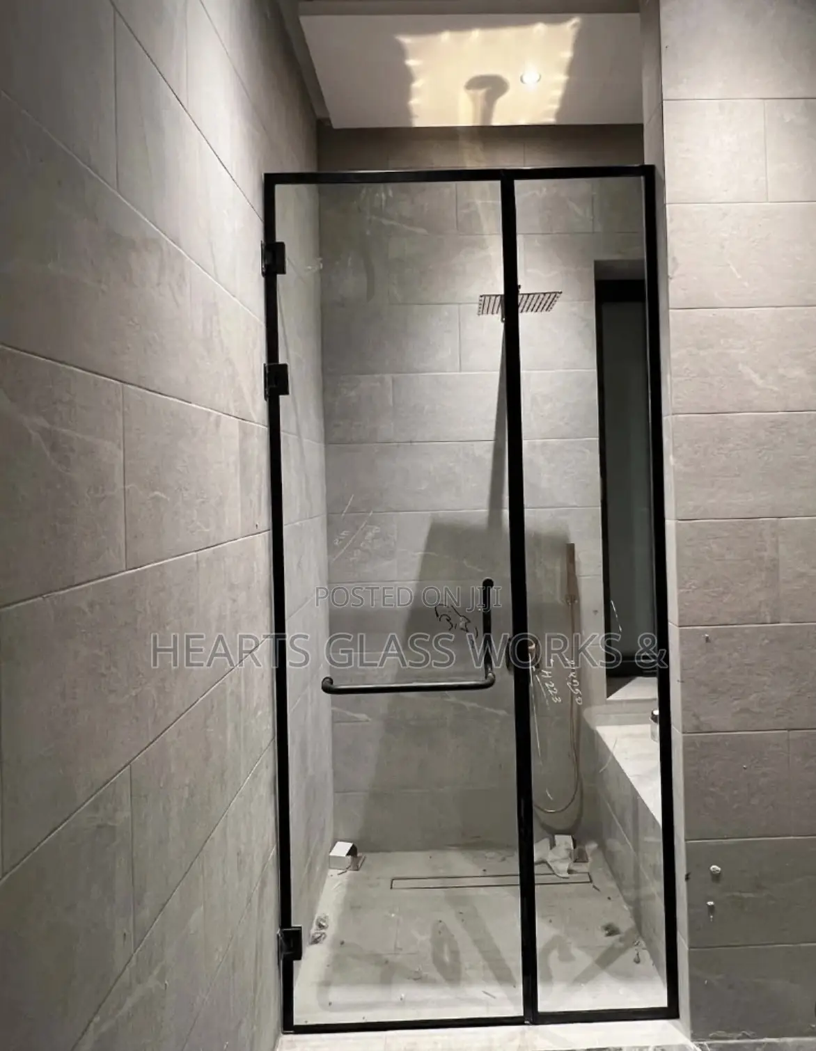 Sleek Fixed Panel + Hinge Door Shower Cubicle Installed. 