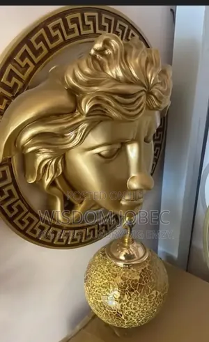 Resin Wall Lamp Featuring a Golden Medusa Head Design.