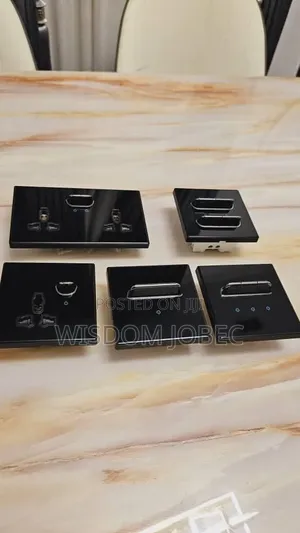 Luxury Electrical Switches and Sockets With Black Glass Panels.