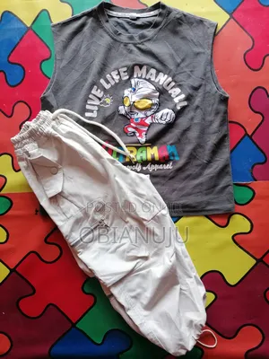 A Sleeveless Shirt Paired With Cago Pant ( Boys)