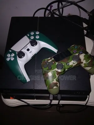 Sony Ps4 With 2 Controllers and 8 Games