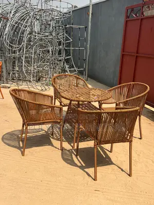 Outdoor Wicker Patio Furniture Set With a Round Table and Chairs