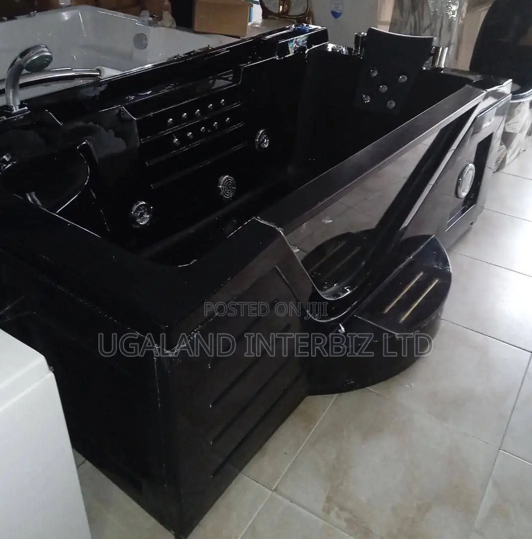 Executive Black Jacuzzi With Built in Step and Padded Headrest