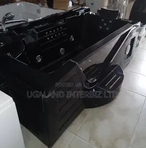 Executive Black Jacuzzi With Built in Step and Padded Headrest