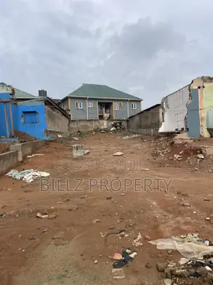 A More Than a Half Plot of Land on a Very Busy Tarred Road