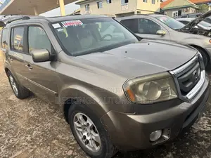 Honda Pilot Touring w/RES/Navi 4WD (3.5L 6cyl 5A) 2010 Gold
