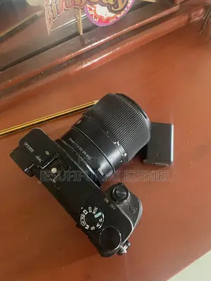 Sony A6300 With 30mm Sigma 1.4 Lens, Extra Battery Camera Bag 64g Sd