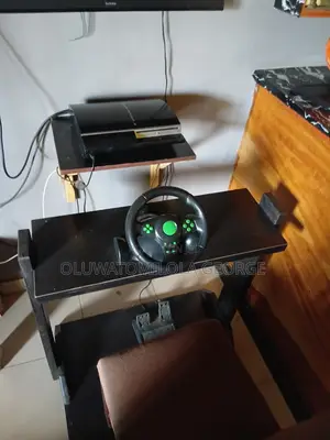 Ps3 Gaming Console And Steering Wheel Controller For Sale